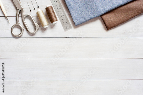 Sewing items on the light wooden table
