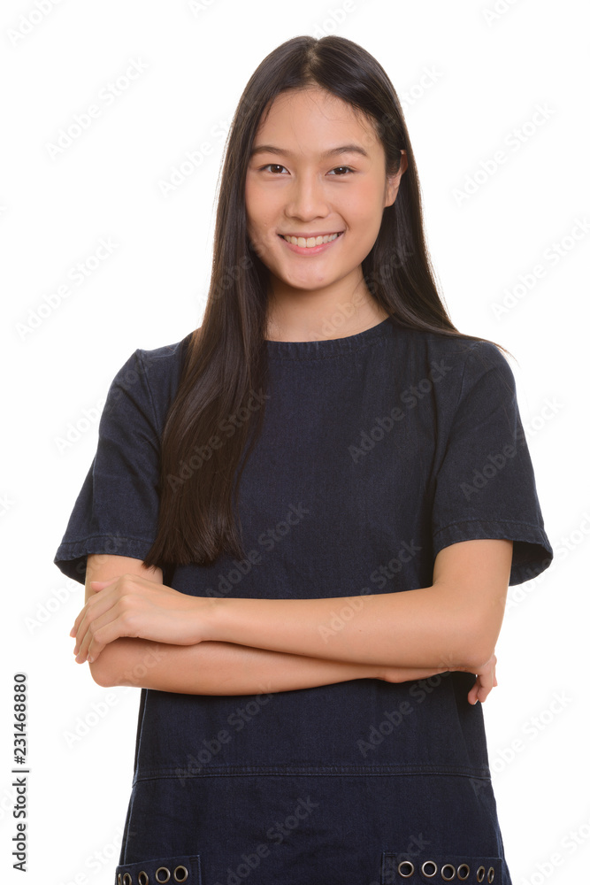 Portrait of young happy Asian teenage girl smiling Portrait of young happy Asian teenage girl smiling