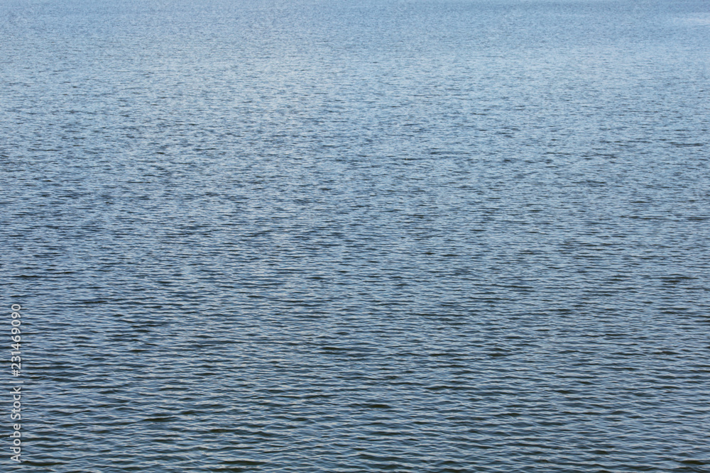 Water surface with small waves, abstract nature background. Water surface with small waves, abstract nature background.