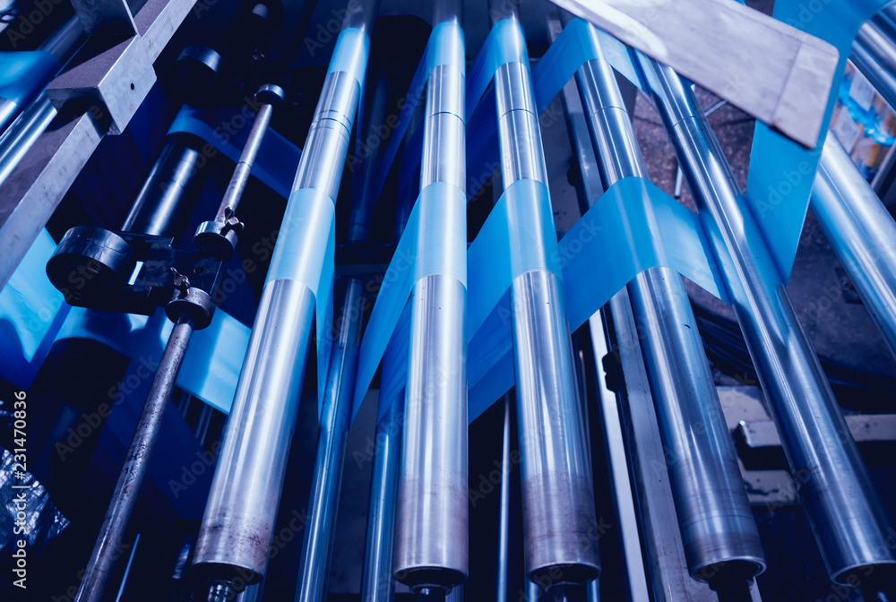 Modern automated production line in factory. Plastic bag manufacturing process Modern automated production line in factory. Plastic bag manufacturing process