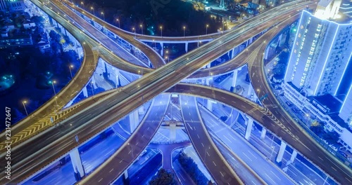 aerial view of traffic on freeway interchange at night