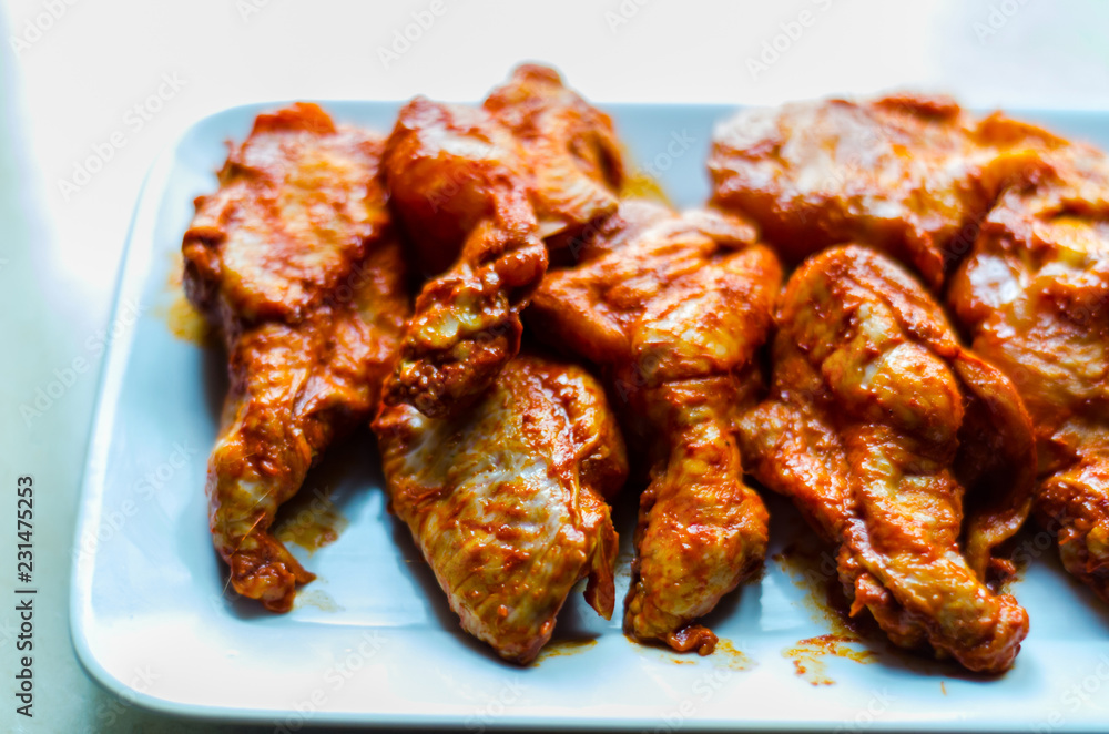 chicken wings marinated in a barbecue sauce, a typical American snack