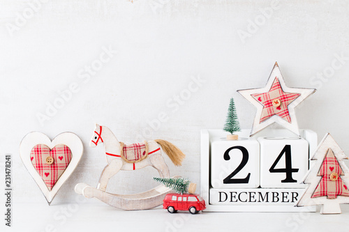 Christmas backgrounds. Christmas calendar, 24 december on the gray background.