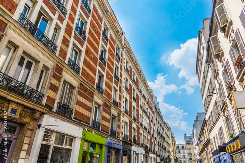 Blue sky over elegant buildings in Montmartre neighborhood