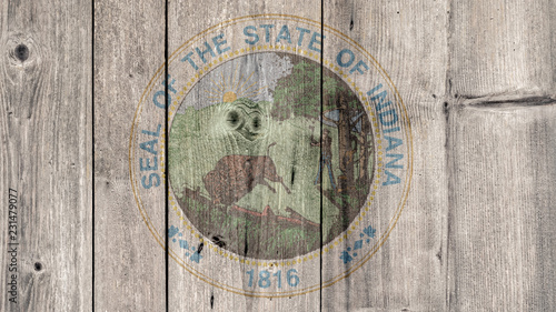 USA Politics News Concept: US State Indiana Seal Wooden Fence Background