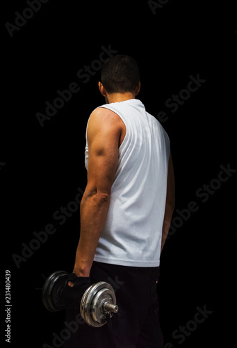Man with dumbbell seen from behind