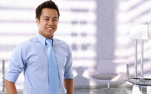 Portrait of happy young asian businessman