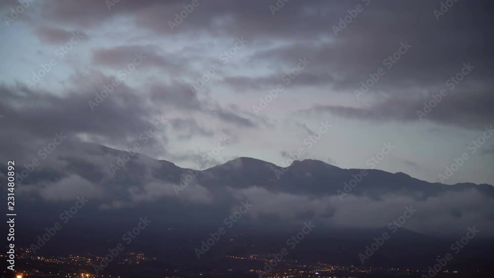 Time lapse of clouds moving over the mountains at the evening Time lapse of clouds moving over the mountains at the evening