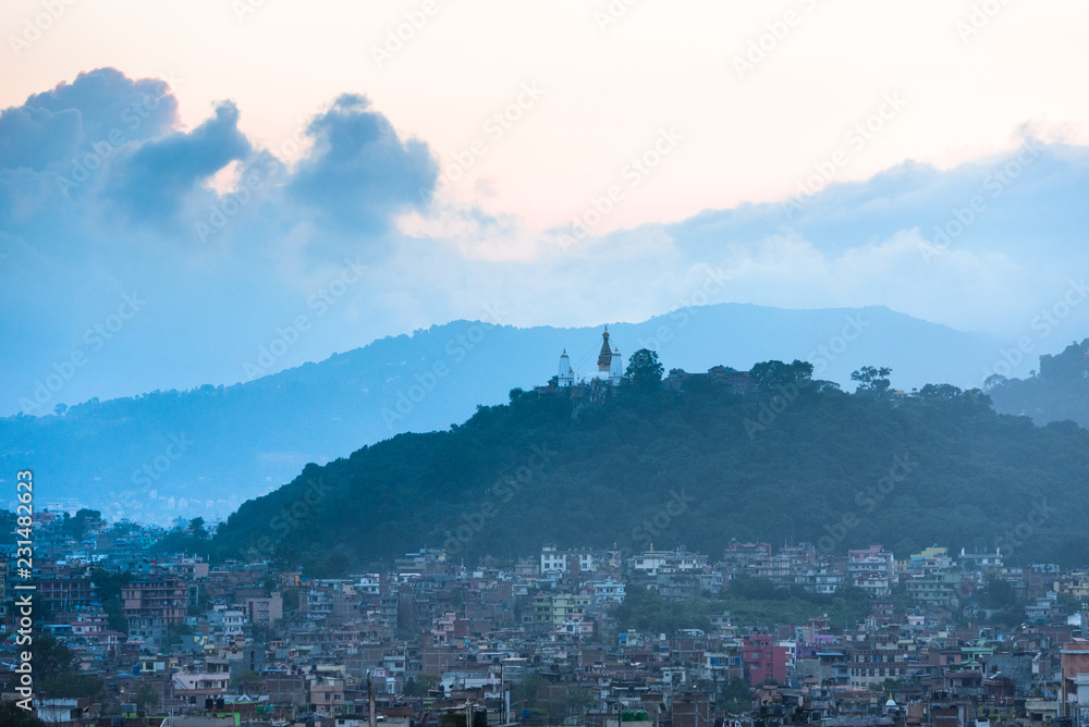 View of Stupa in Swayambhunath Monkey temple and vicinity of house in Kathmandu, Nepal.