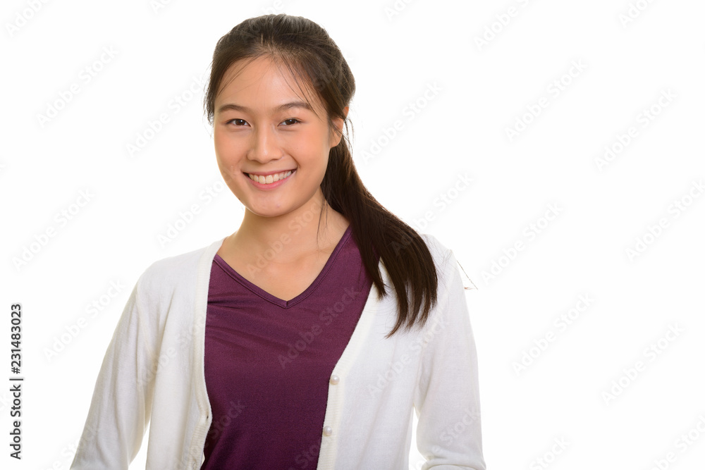 Portrait of young happy Asian teenage girl smiling Portrait of young happy Asian teenage girl smiling