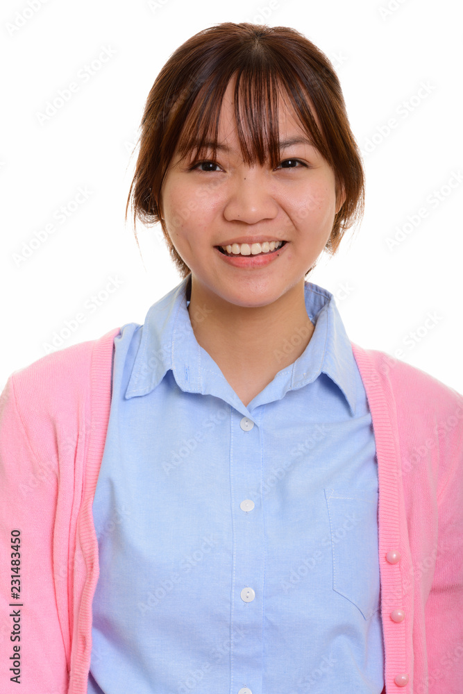 Portrait of young happy Asian teenage girl smiling Portrait of young happy Asian teenage girl smiling