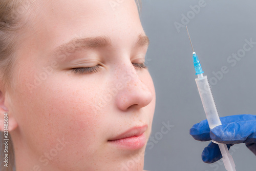 Beautiful woman gets injections. Cosmetology. Beauty Face.cropped shot of young woman getting beauty injection made by cosmetologist in salon  