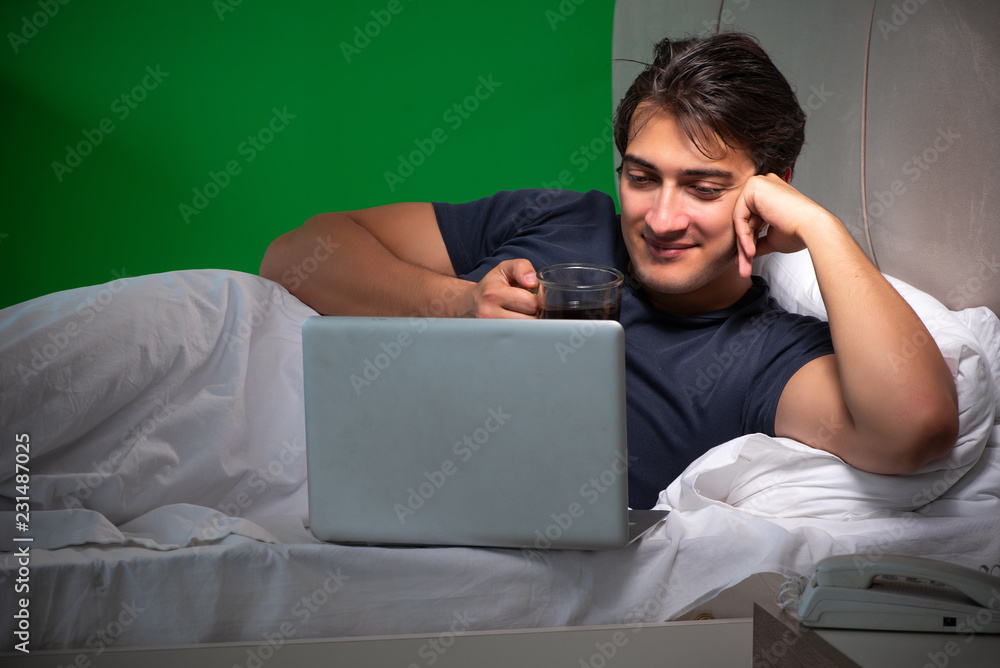 Young handsome man suffering from insomnia at home Young handsome man suffering from insomnia at home