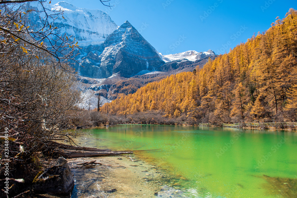 pearl lake with snow mountain  in yading nature reserve, Sichuan, China.