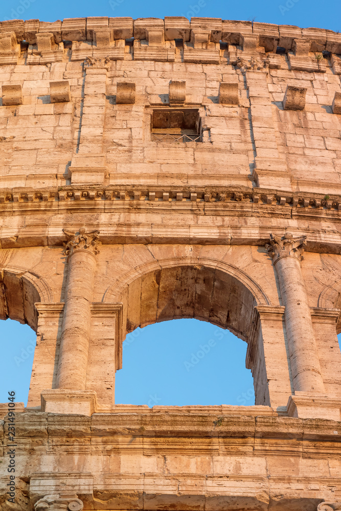 Closeup front view of the arch of Colosseum in sunset light. Rome Italy. Closeup front view of the arch of Colosseum in sunset light. Rome Italy.