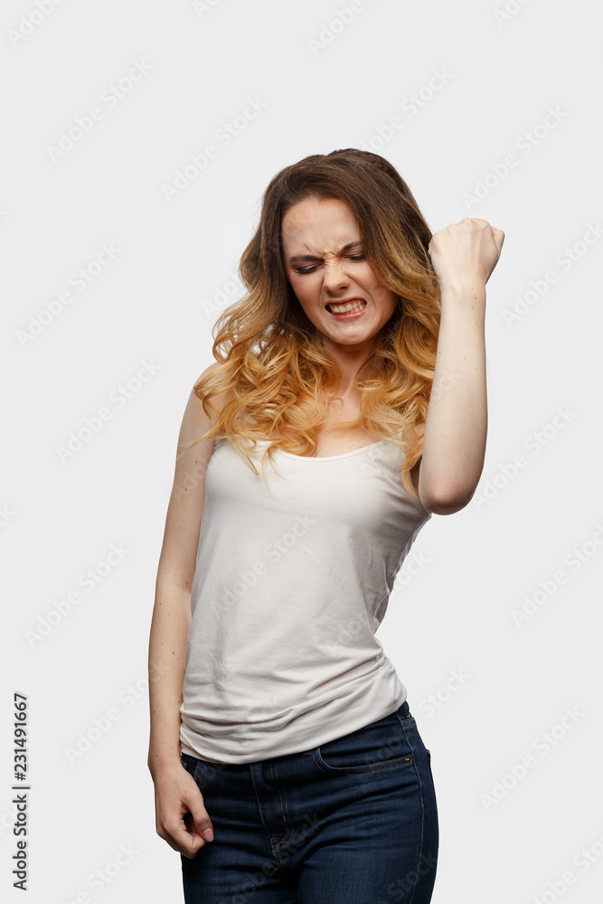 Emotional girl makes an energetic hand gesture Emotional girl makes an energetic hand gesture