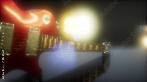 electric guitar in the dark with bright lights photo