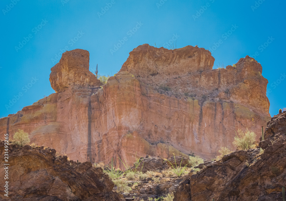 Arizona desert wilderness sheer rocky cliffs surround a man made lake in Arizona's wilderness area