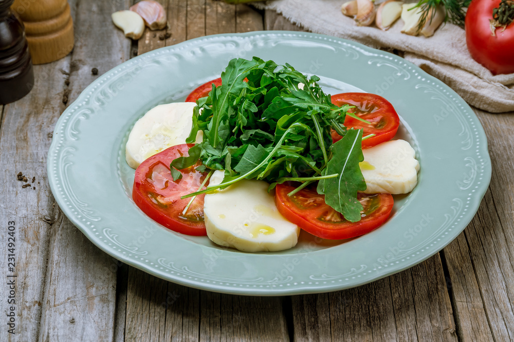 Caprese salad with mozzarella and tomato Caprese salad with mozzarella and tomato