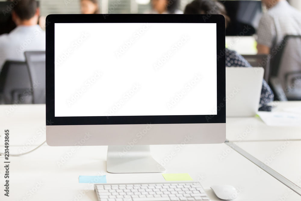 Mock up white computer screen on desk at office background, mockup blank display on table at workplace, empty device monitor with copyspace and icons for business work and software applications usage Mock up white computer screen on desk at office background, mockup blank display on table at workplace, empty device monitor with copyspace and icons for business work and software applications usage