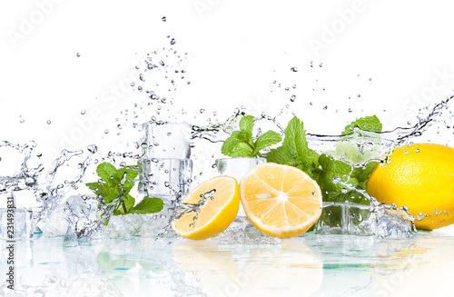 ice cubes and splashing water with mint and lemon on a white background...