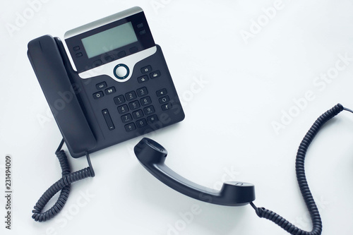 Deskphone, office and business concept. New ip phone with buttons and big display for communication without interference. Top view. Space for a text. Close up.
