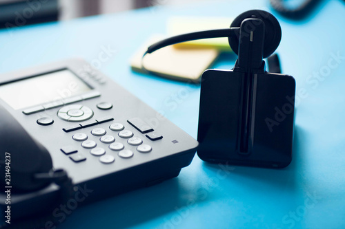 Deskphone, office and business concept. New ip phone with buttons and big display for communication without interference. Top view. Space for a text. Close up. photo