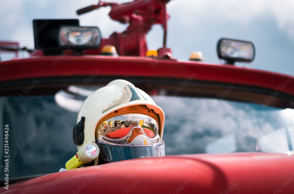 Fototapeta premium Low angle close-up of a shiny reflecting firefighter's helmet.