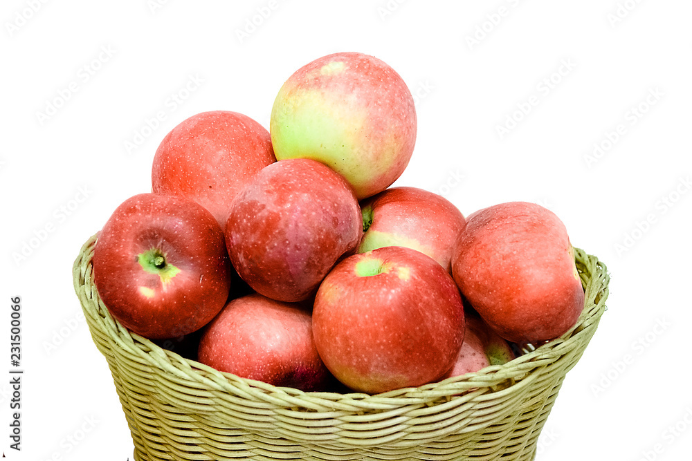 Ripe red apple in wicker basket isolated on white Ripe red apple in wicker basket isolated on white