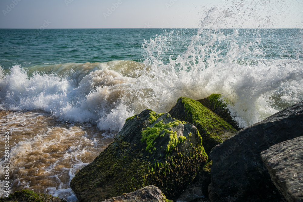 waves splashing over rocks