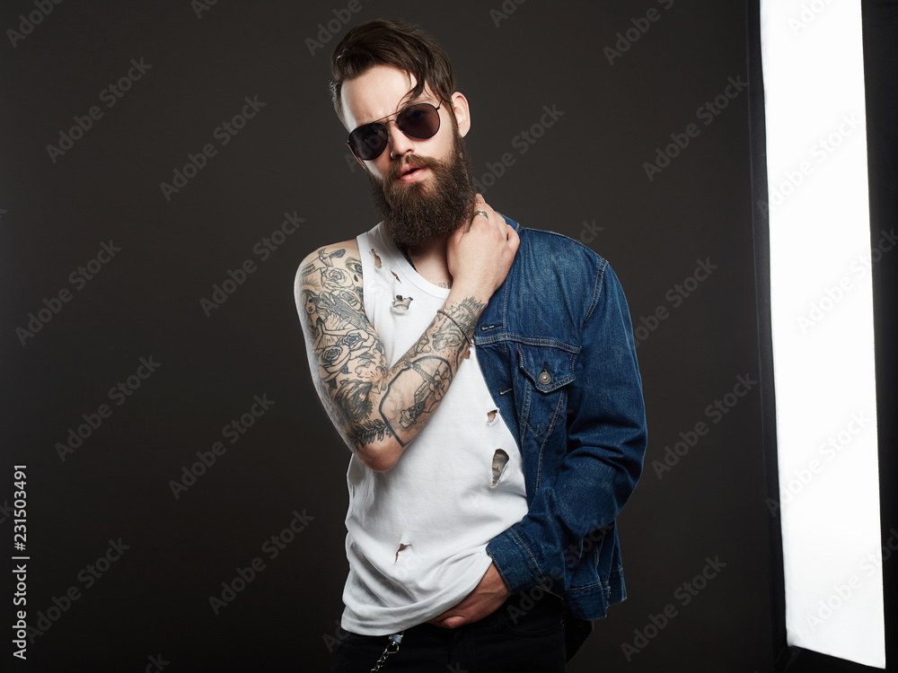 Plakat Hipster bearded Stylish boy in jeans and glasses