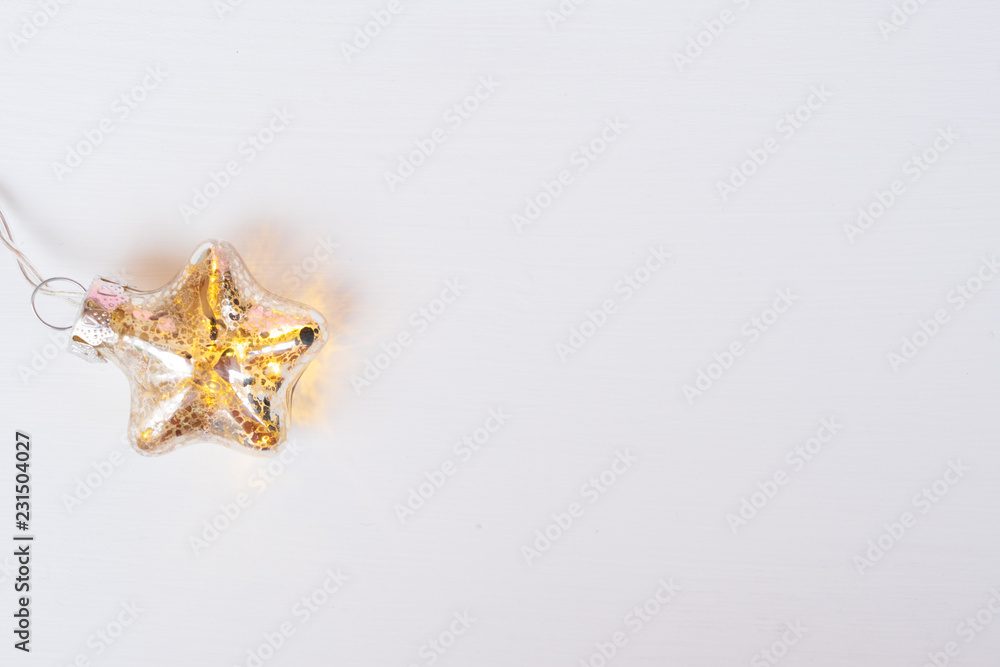 Christmas glowing star on white wooden background Christmas glowing star on white wooden background