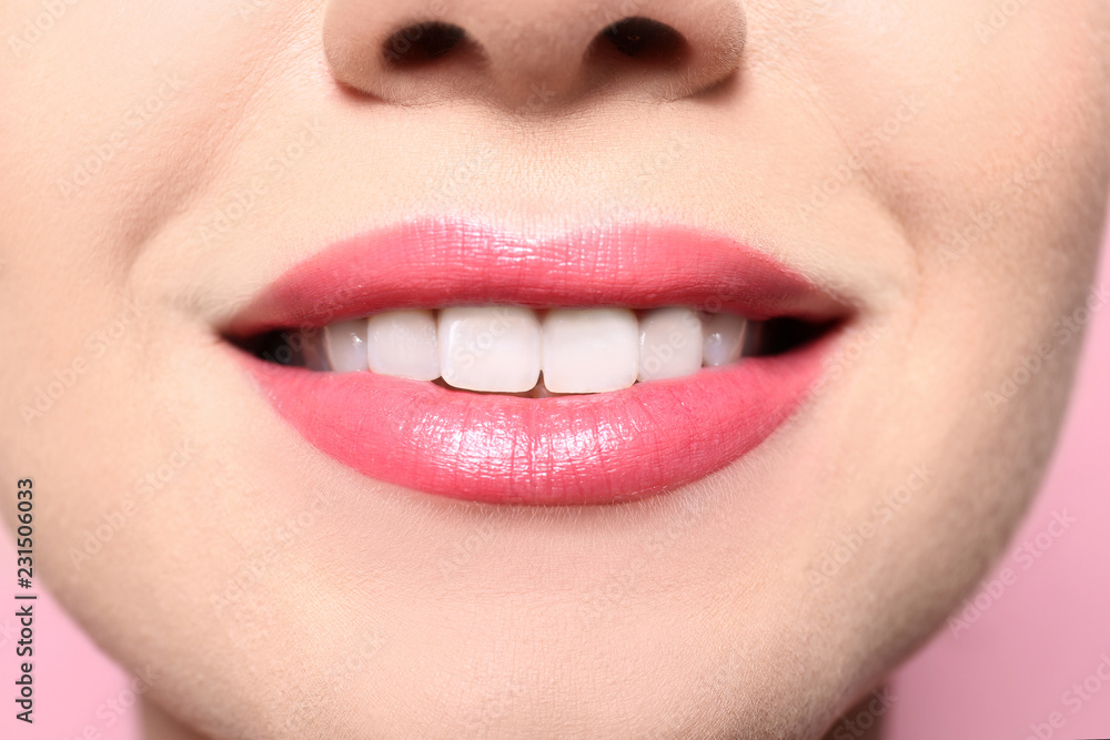 Beautiful young woman with perfect lips makeup on color background, closeup Beautiful young woman with perfect lips makeup on color background, closeup