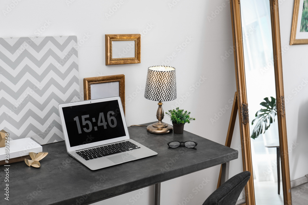 Fototapeta premium Stylish workplace with modern laptop on table indoors