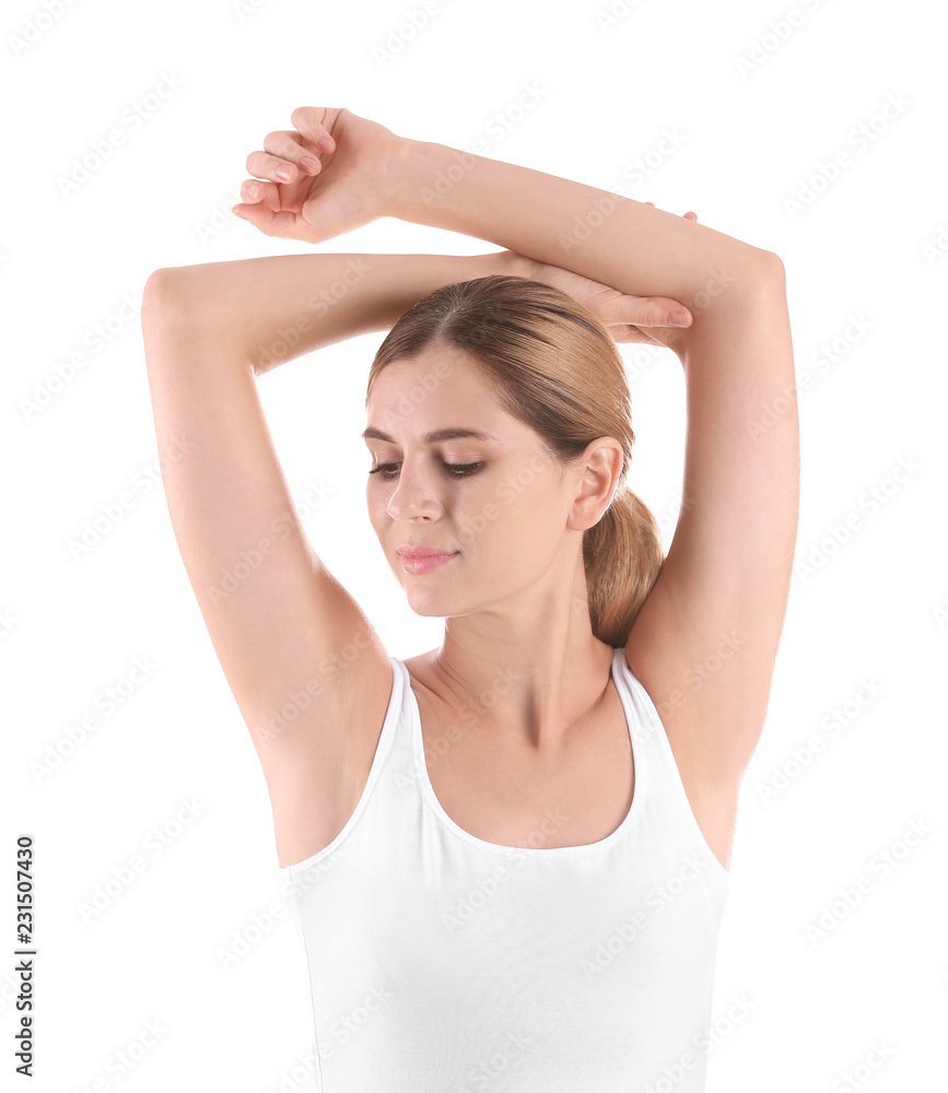 Young woman showing armpit on white background. Using deodorant