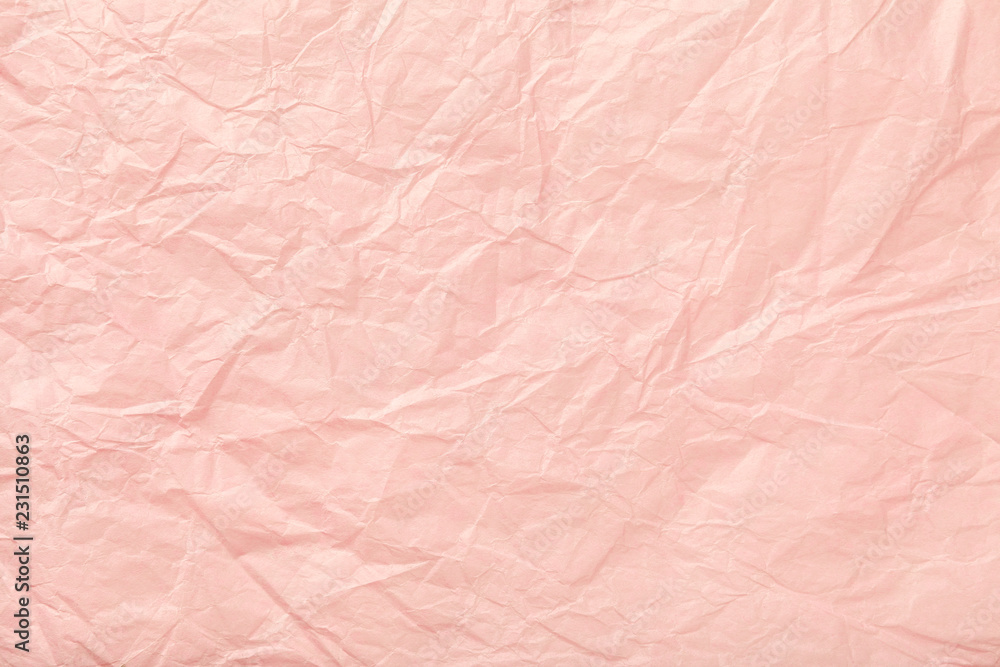 Crumpled pink wrapping paper, closrup.