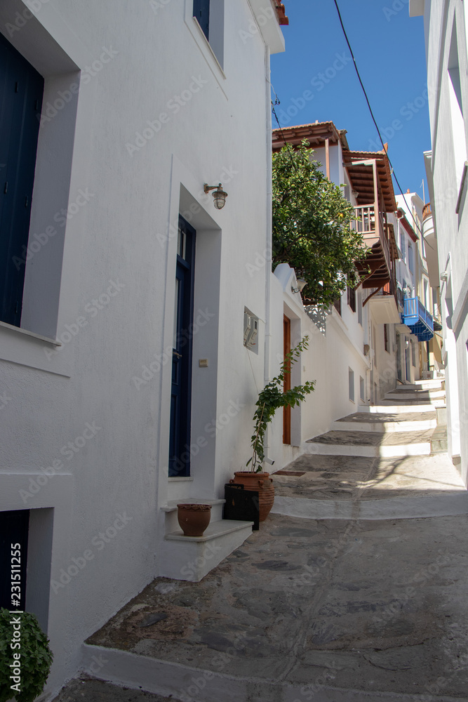 Small Street and Beautiful Traditional White Greek Houses on Skopelos Island, Northern Sporades in the Aegean Sea