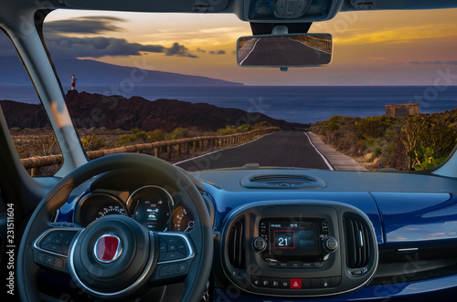 vision of traveling by car, the view from behind the steering wheel