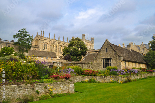 Beautiful English Garden With Classic House and Church. England landscape. Colorful flowers
