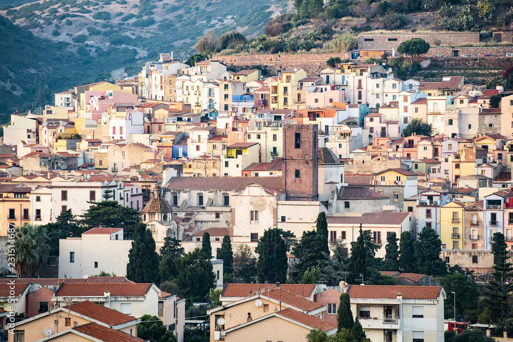 The beautiful village of Bosa with colored houses and a medieval castle on the top of the hill. Bosa is located in the north-west of Sardinia, Italy.