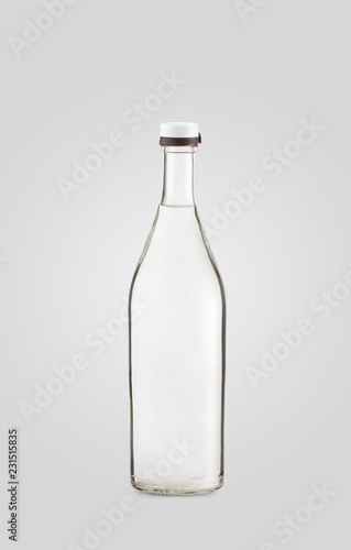 closed transparent bottle of drink on white background with shadow