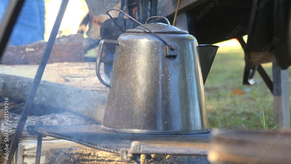 Antique Metal Coffee Pot Over A Wire Rack With Smoke Rising Antique Metal Coffee Pot Over A Wire Rack With Smoke Rising