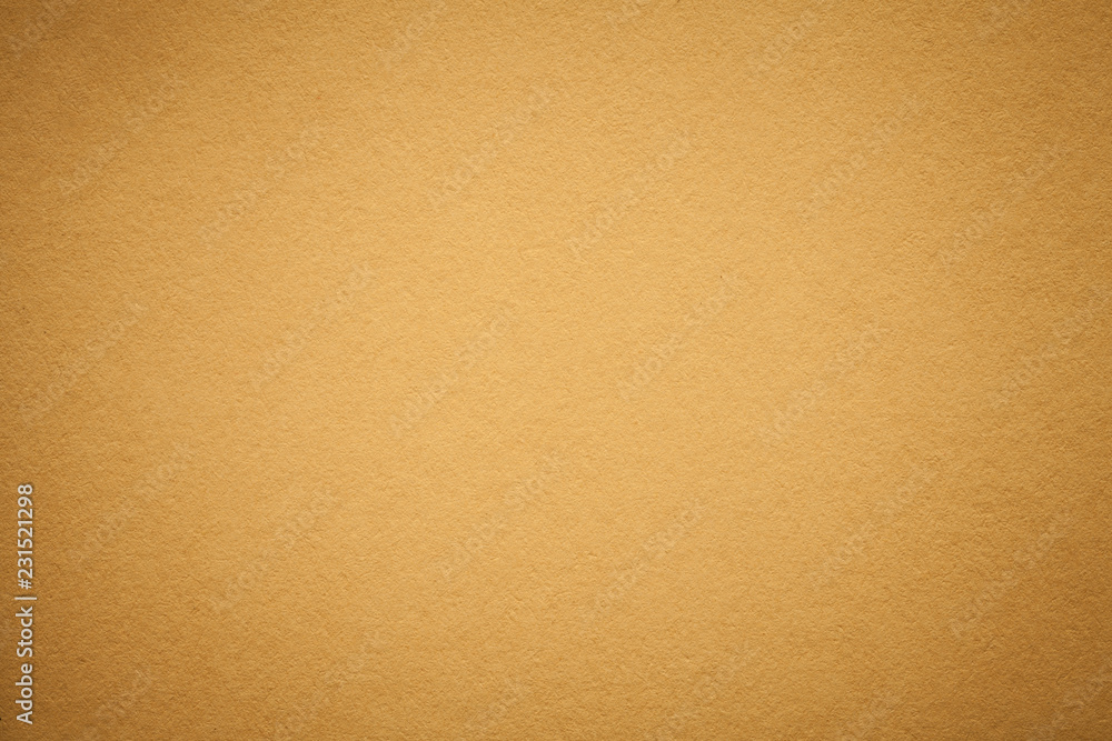 Texture of old golden paper background, closeup. Structure of dense light orange cardboard. Texture of old golden paper background, closeup. Structure of dense light orange cardboard.
