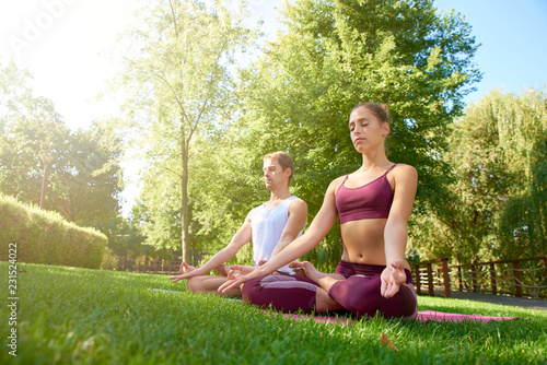 Couple practicing yoga outdoor