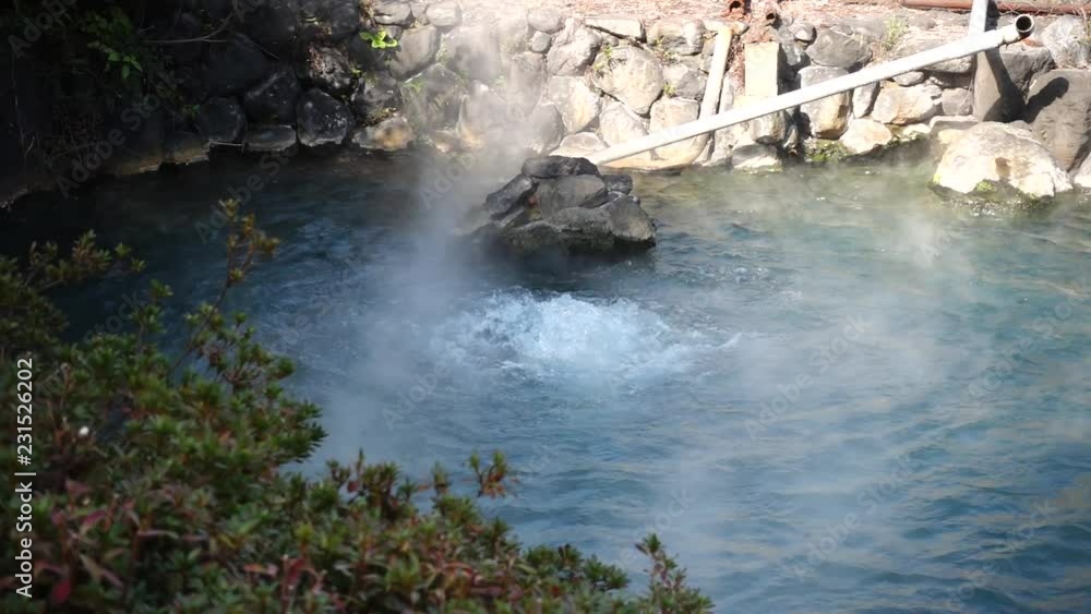 hot thermal spring framed by granite boulders. Japan, Beppu. hot thermal spring framed by granite boulders. Japan, Beppu.