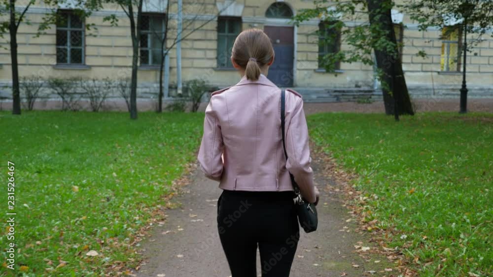 Woman walk alone in dangerous city district Woman walk alone in dangerous city district