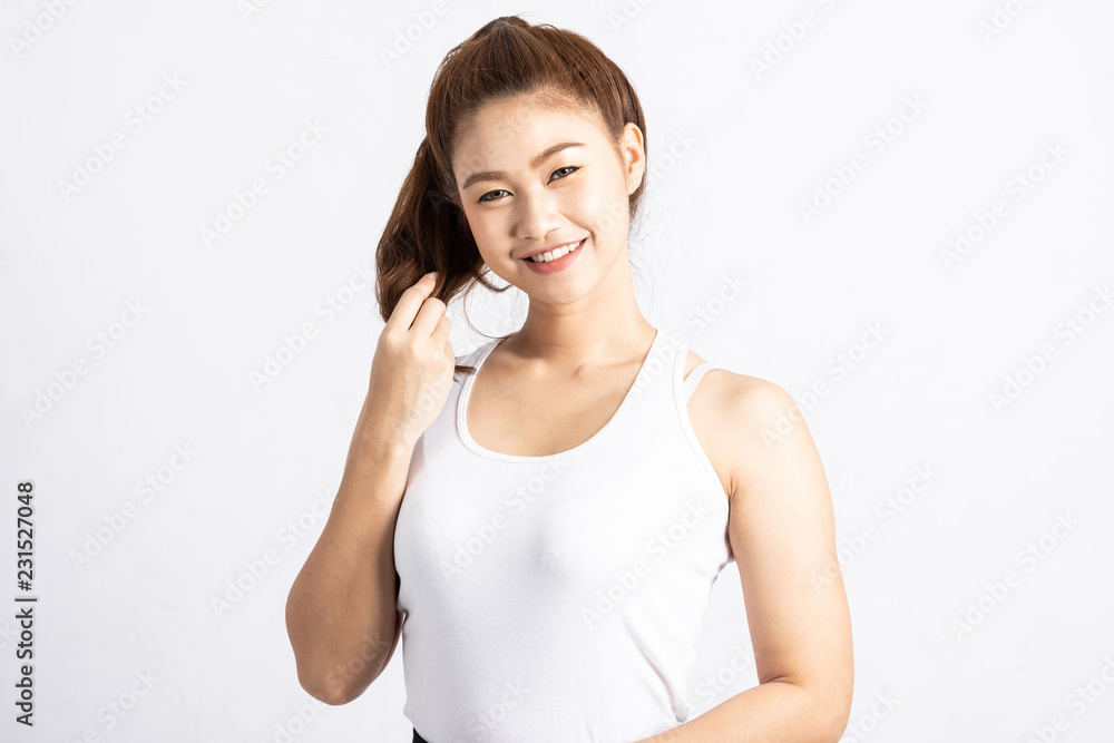 Beautiful Attractive Asian woman smile and touching smooth her hair feeling so happiness and cheerful with healthy skin isolated on grey background,Beauty Concept Beautiful Attractive Asian woman smile and touching smooth her hair feeling so happiness and cheerful with healthy skin isolated on grey background,Beauty Concept