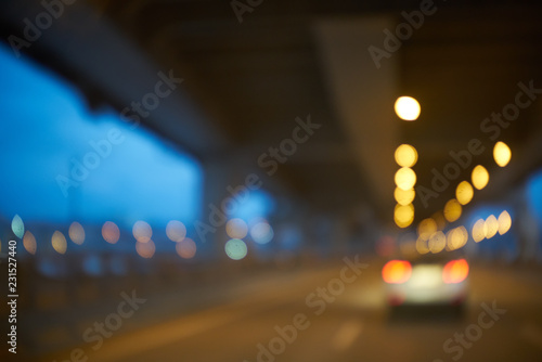 Blurred abstract background. defocused bokeh of evening road with lanterns