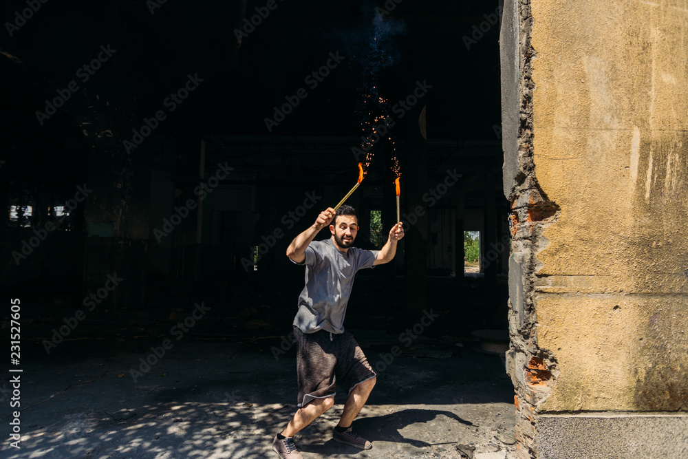 Man while using pyrotechnics outdoors