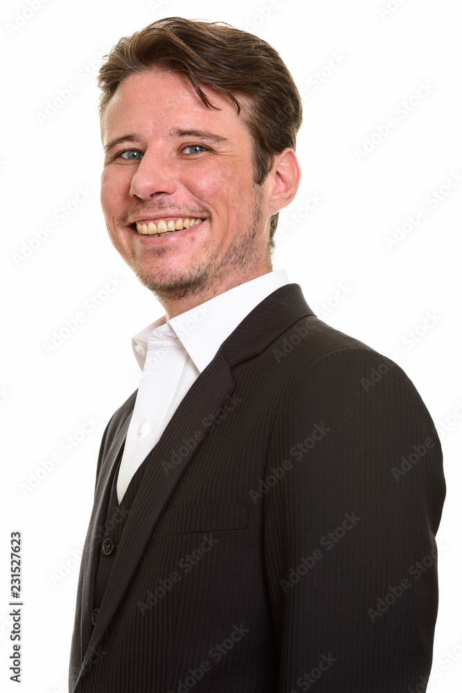 Happy Caucasian businessman smiling and looking at camera Happy Caucasian businessman smiling and looking at camera